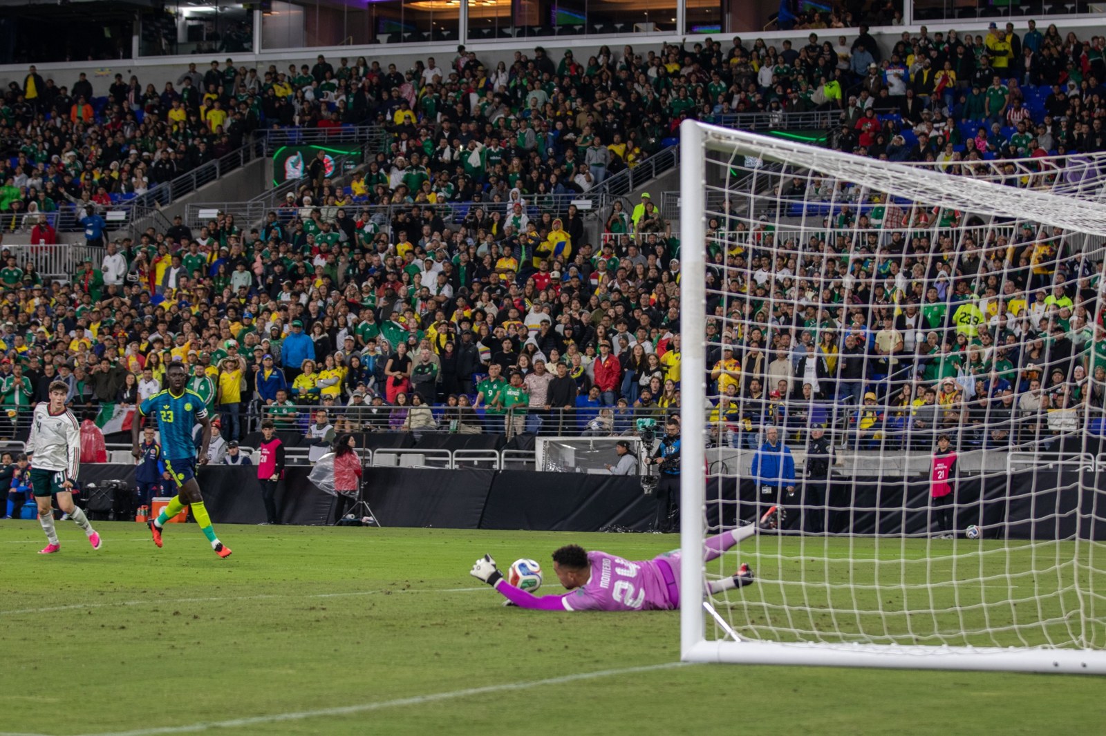 Colombia’s goalkeeper dives toward the ball.